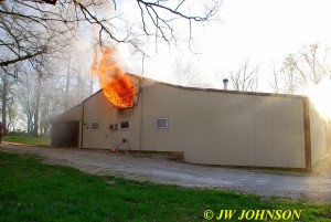 Heavy Fire Rolls Out Vent Above Home End