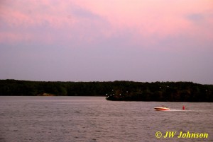 Speedboat and Birds Enhance Sunset