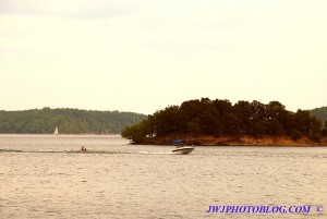 Speedboat and Water Surfers