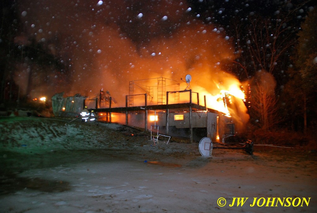 Firefighters At Back of House