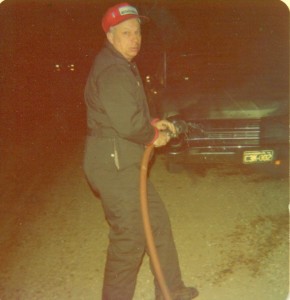 Dad with Hose on Car Fire