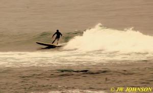 Surfer Rides The Waves 8
