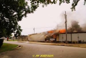 27 Heavy Fire Blows Out of Cason Realty Roof