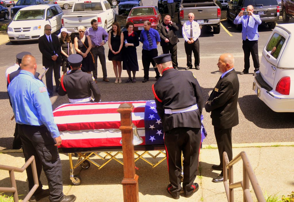 52 Pallbearers Prepare to Load Casket